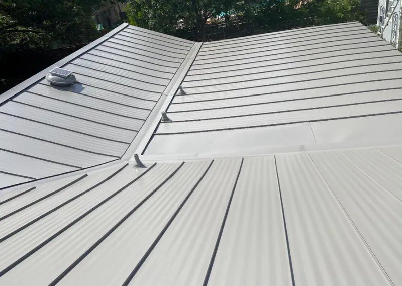Solar attic fan installed on a metal roof for Roof Ventilation in Canterbury